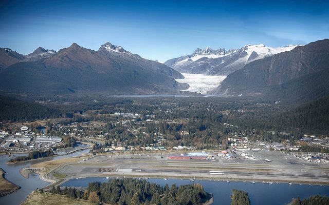 Aerial view of Juneau airport and the Mendenhall Valley, with the glacier between the mountains