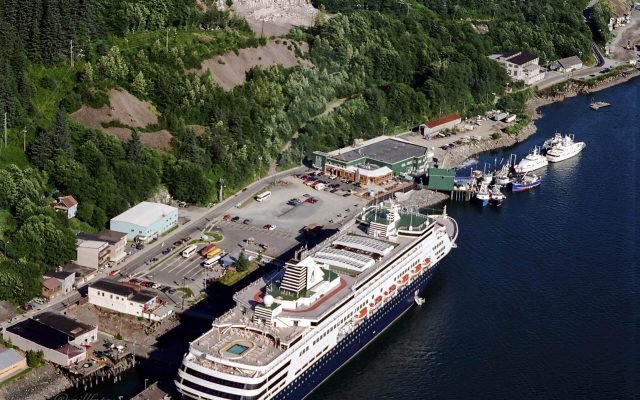 A cruise ship moored at the downtown Juneau docks, seen from high on the mountainside